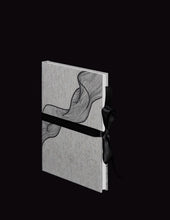 Load image into Gallery viewer, takkti limited notebook collection line art swirl design raw linen with a black print and black ribbon with white pages
