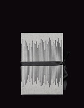 Load image into Gallery viewer, takkti limited notebook collection line art vertical lines design raw linen with a black print and black ribbon