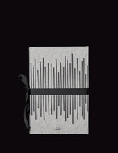 Load image into Gallery viewer, takkti limited notebook collection line art vertical lines design raw linen with a black print and black ribbon