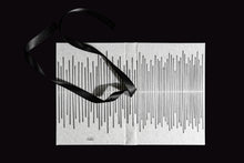 Load image into Gallery viewer, takkti limited notebook collection line art vertical lines design raw linen with a black print and black ribbon