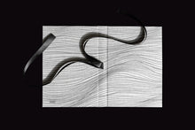 Load image into Gallery viewer, takkti limited notebook collection line art waves design raw linen with a black print and black ribbon