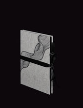 Load image into Gallery viewer, takkti limited notebook collection line art swirl design raw linen with a black print and black ribbon with black pages