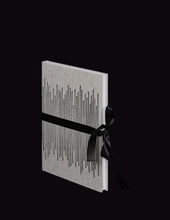 Load image into Gallery viewer, takkti limited notebook collection line art vertical lines design raw linen with a black print and black ribbon with white pages