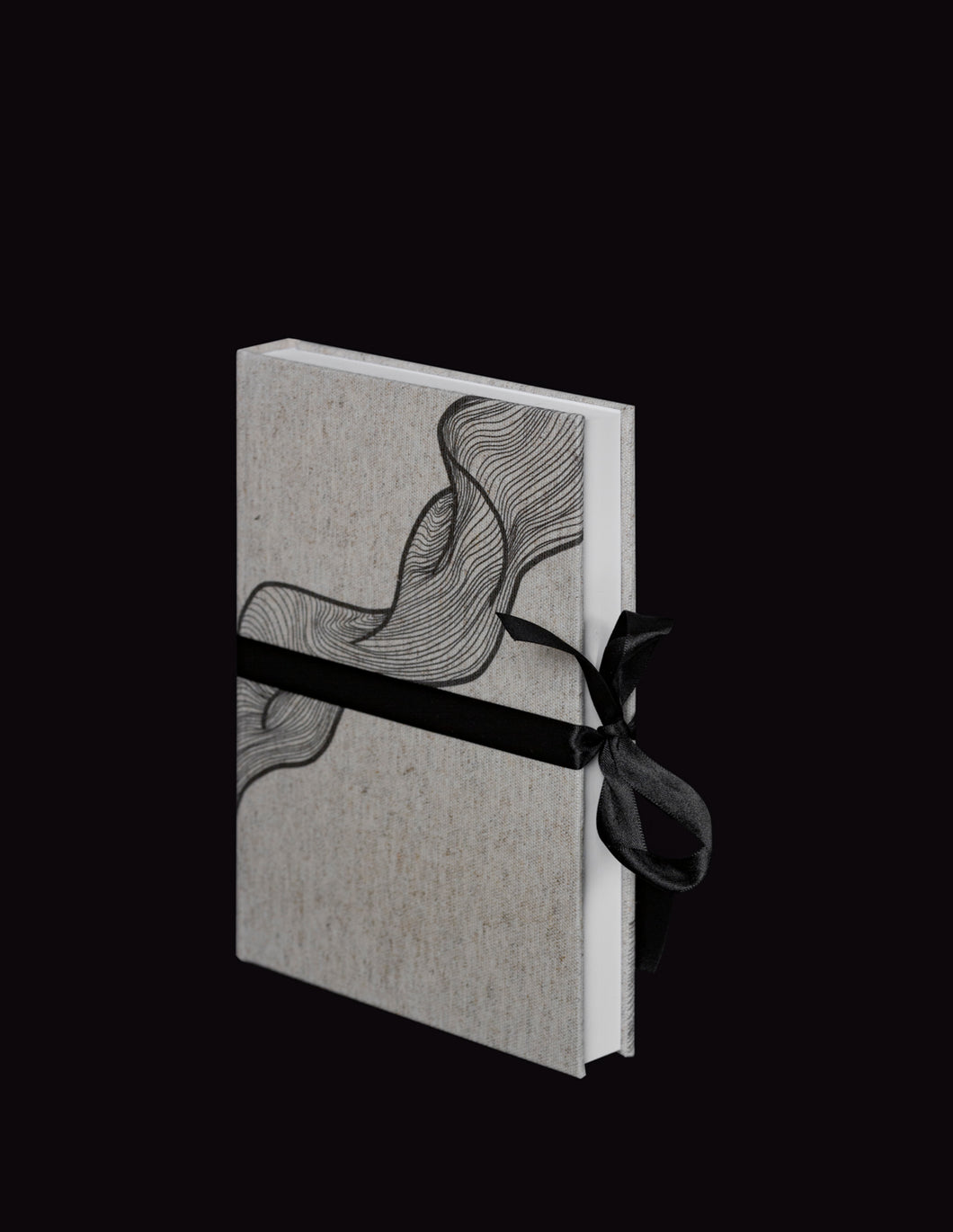 takkti limited notebook collection line art swirl design raw linen with a black print and black ribbon with white pages